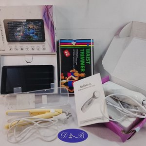 Lote siguiente: Planchita de pelo, masajeador corporal y tablet (sin probar)