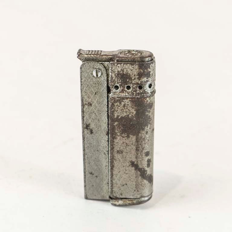 Lote anterior: Encendedor de metal con detalles en mal estado
