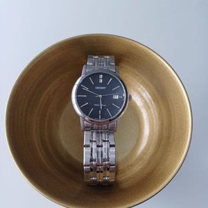 Lote siguiente: Reloj Orient de Acero Inoxidable con Esfera Negra y Ventana de Fecha