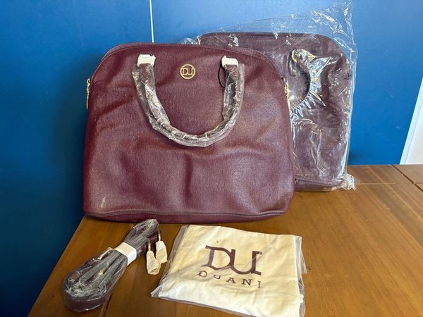 Lote de 10 Carteras Color Borravino con Logo DUANI - imagen 1