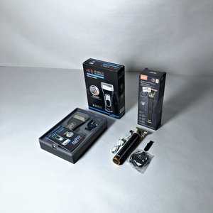 Lote siguiente: Dos Máquinas de Afeitar Eléctricas y Recortadora Personal con Accesorios