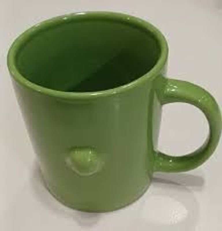Lote siguiente: Taza Ceramica Verde con Detalle Tipo Nariz