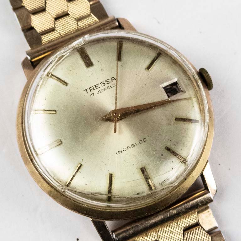 Lote siguiente: Reloj Tressa con calendario y enchapado