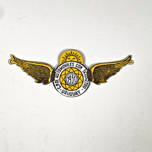 Lote siguiente: Chapa Esmaltada "Automóviles con Taxímetro Uruguay 1931" Alas Doradas