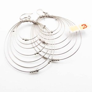 Lote siguiente: Caravanas de Plata con Bolitas y Diseño Circular