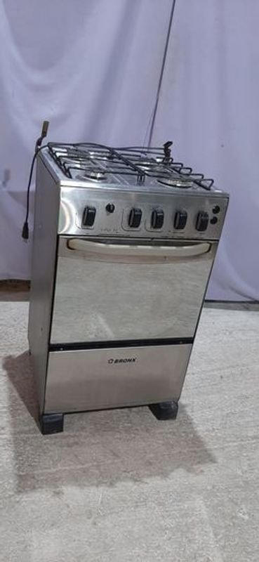 Cocina a Gas Bronx Plateada 4 Hornallas con Horno