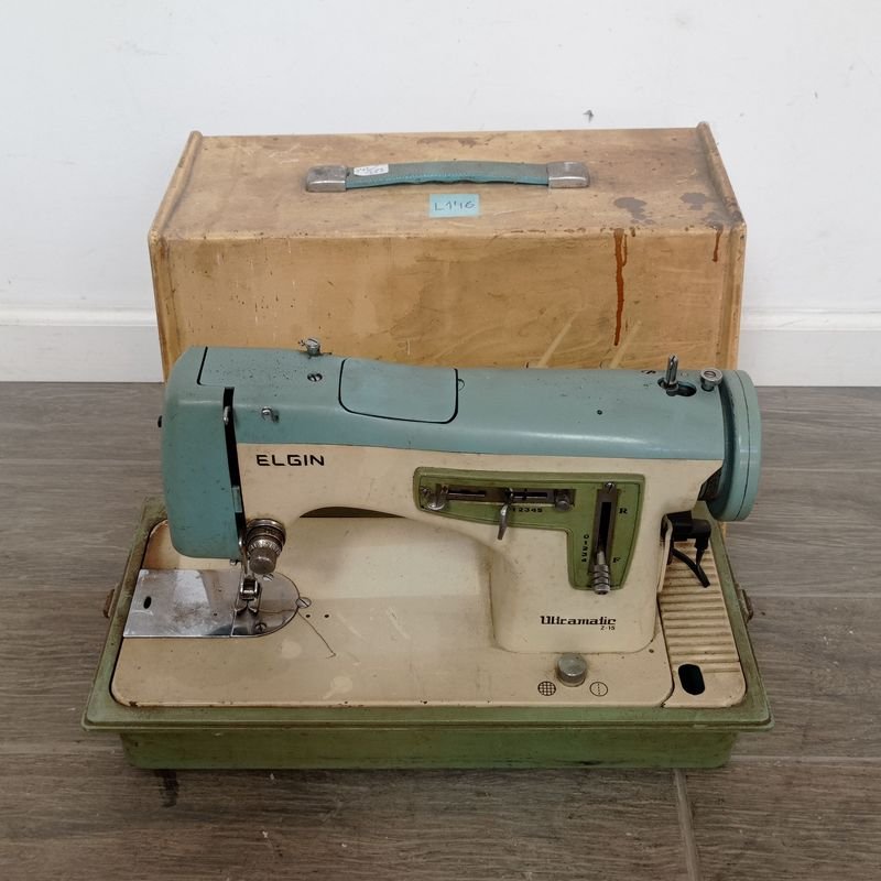 Lote siguiente: Maquina de coser Elgin en venta