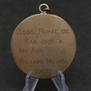 Lote siguiente: Medalla "The British Schools Montevideo" "Asoc. Rural de San José Ing. Agr."