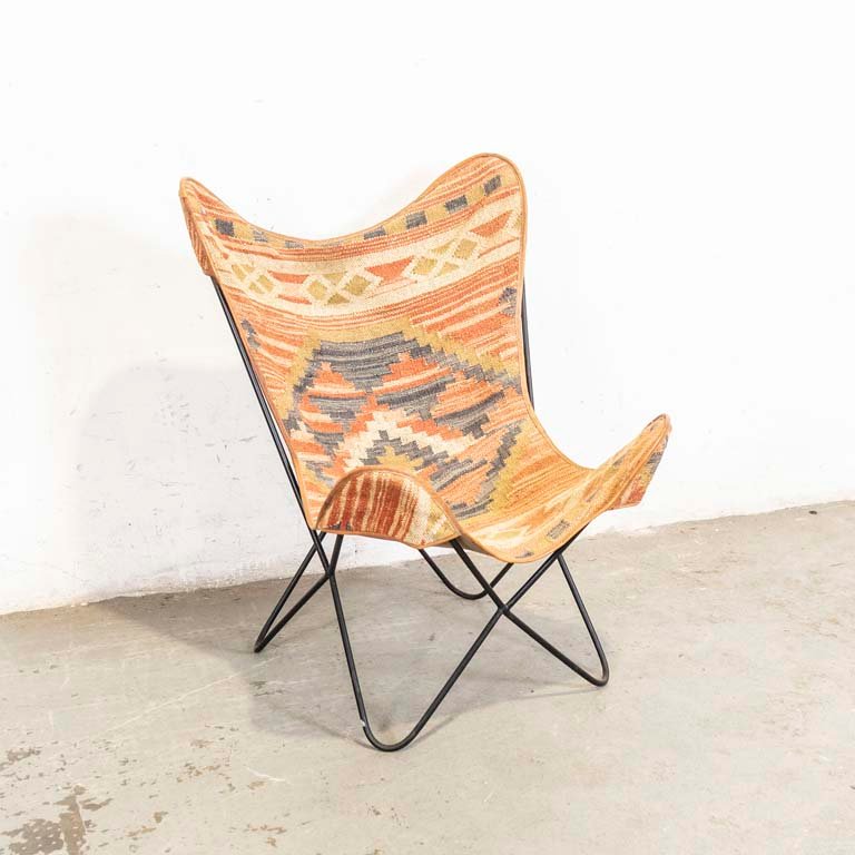 Lote anterior: Sillón africano de estructura de hierro y asiento de tela