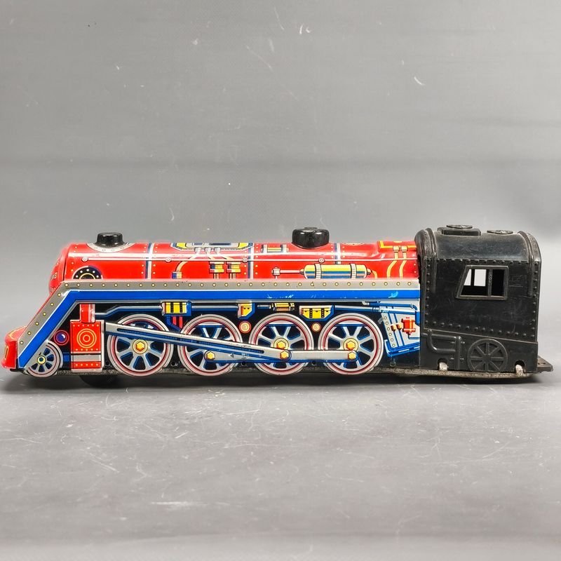 Lote siguiente: Locomotora en chapa litografiada a fricción japonesa