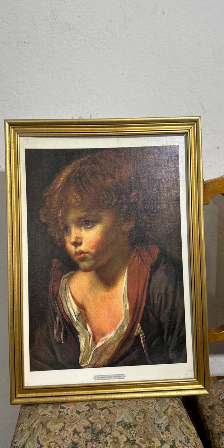 Cuadro de niño con marco dorado