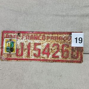 Lote siguiente: Matrícula Antigua de Cerro Largo Roja con Desgaste