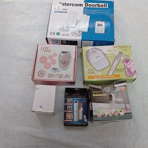 Lote siguiente: Seis piezas: depiladora femenina, torno para uñas, portero eléctrico, calentador de agua instantáneo para canilla y otros.
