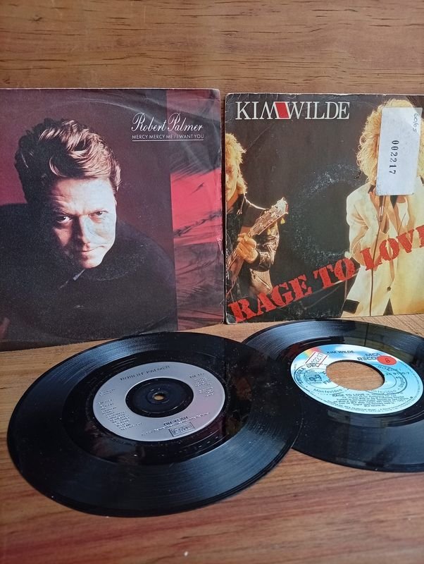 Dos discos simples: Robert Palmer "Mercy Mercy Me" (1990) y Kim Wilde "Rage To Love" (1984)