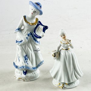 Lote siguiente: Dos figuras en porcelana 14 y 20 cm