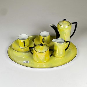 Lote anterior: Juego de porcelana tete a tete ocho piezas, con bandeja