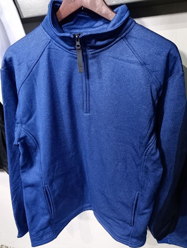 Buzo deportivo azul con cierre