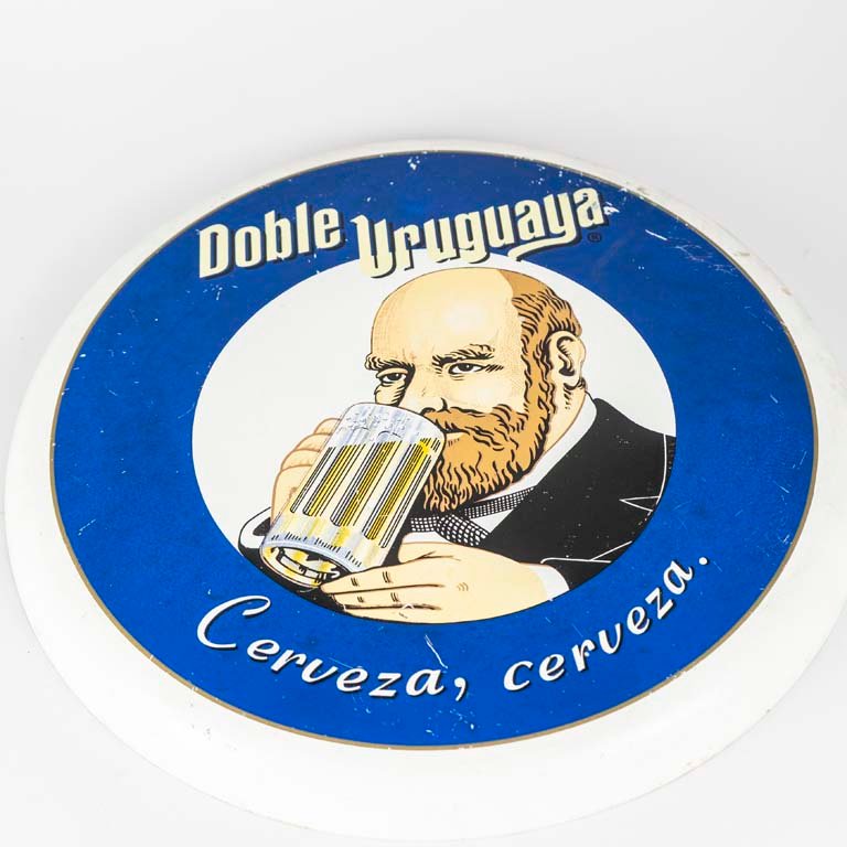 Lote siguiente: Cartel publicitario de cerveza Boble Uruguaya - Medidas: diámetro 45cm