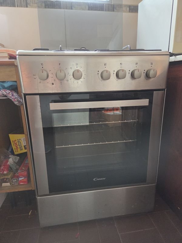 Lote siguiente: Excepcional cocina Candy en acero inoxidable combinada adaptada a supergas