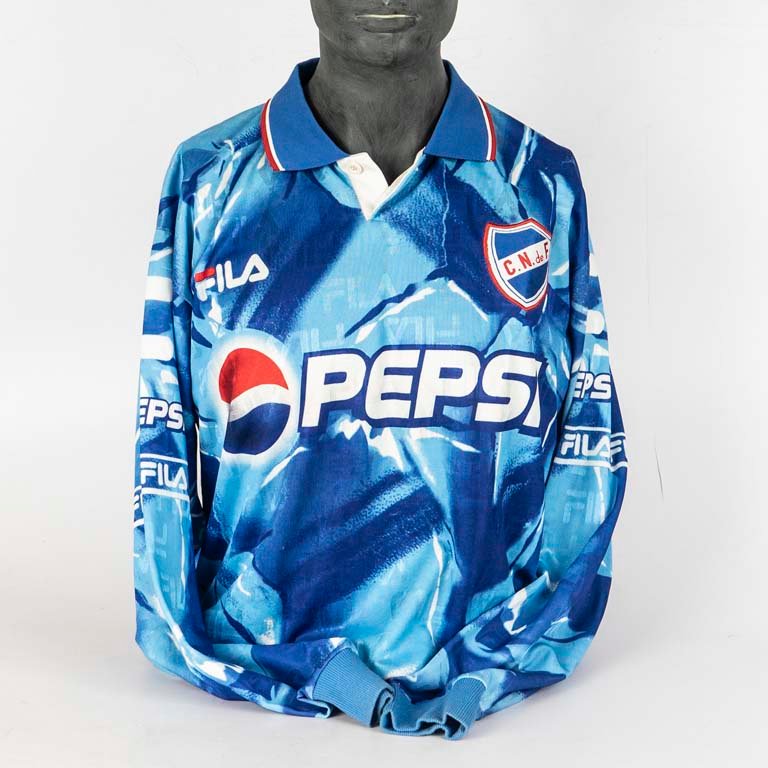 Lote anterior: Camiseta de Nacional oficial de tienda marca FILA sin número segunda equipación de los años 1999/2000
