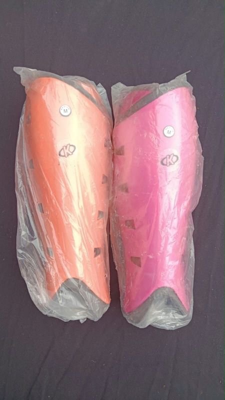 Canilleras de Hockey Naranja y Rosa Talle M