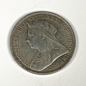 Lote siguiente: Moneda Inglesa de un chelín de 1897 con Victoria Regina
