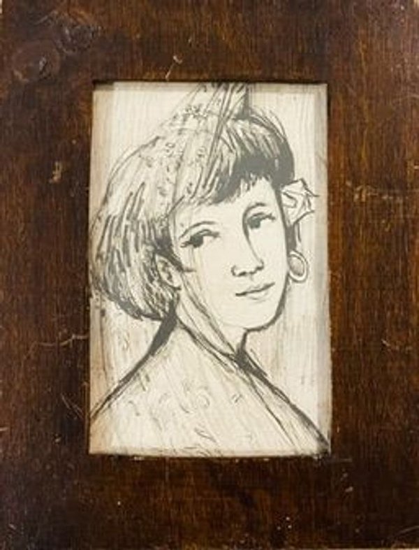 Retrato a lápiz en marco de madera