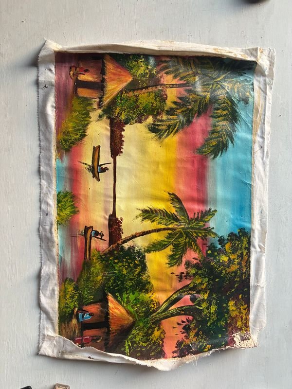 Pintura africana de lienzo con escena colorida