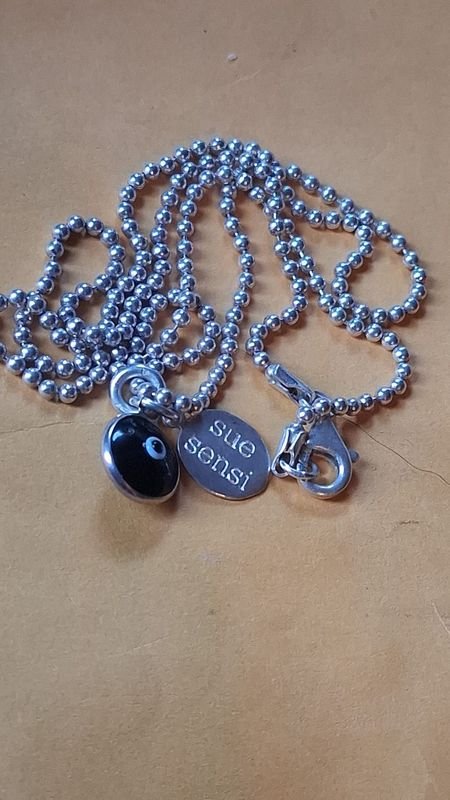 Lote anterior: Cadena de plata con dijes