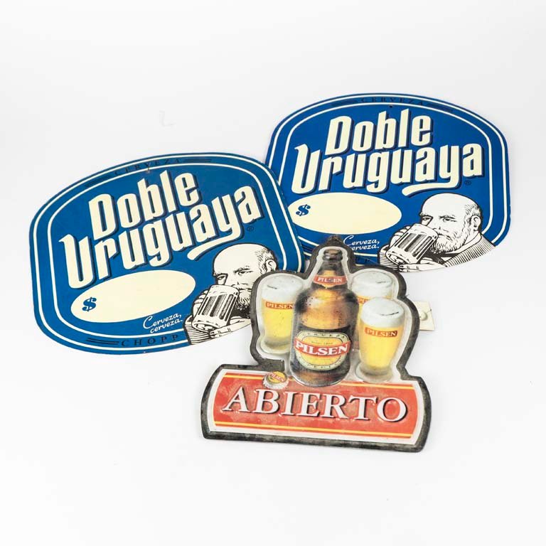Lote siguiente: Carteles publicitarios de cervezas Doble Uruguaya y PILSEN