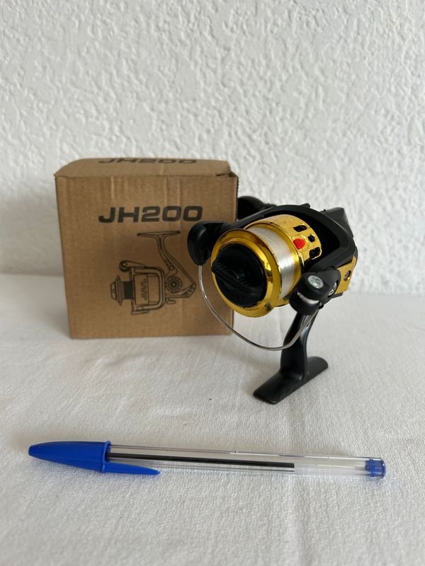 Reel de pesca nuevo y accesorios - imagen 2