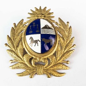 Lote siguiente: Insignia de Bronce y Esmalte para Gorra de Oficial del Ejército Uruguayo