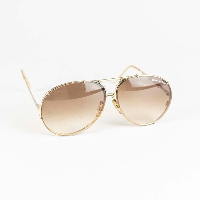 Lote anterior: Par de lentes de sol vintage con diseño deportivo