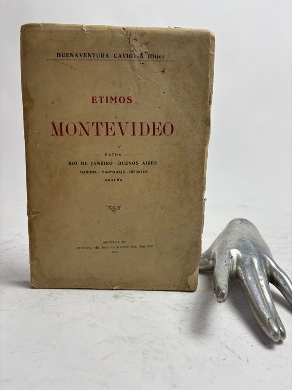 Lote anterior: Buenaventura caviglia(hijo) ETIMOS MONTEVIDEO - montevideo 1932: Un libro antiguo con una mano
