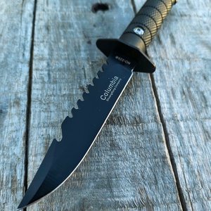 Lote anterior: Cuchillo Columbia Negro con Hoja Serrada y Funda
