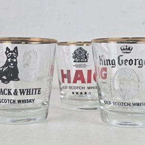 Lote siguiente: Conjunto de 6 Vasos de Whisky con Logos Publicitarios