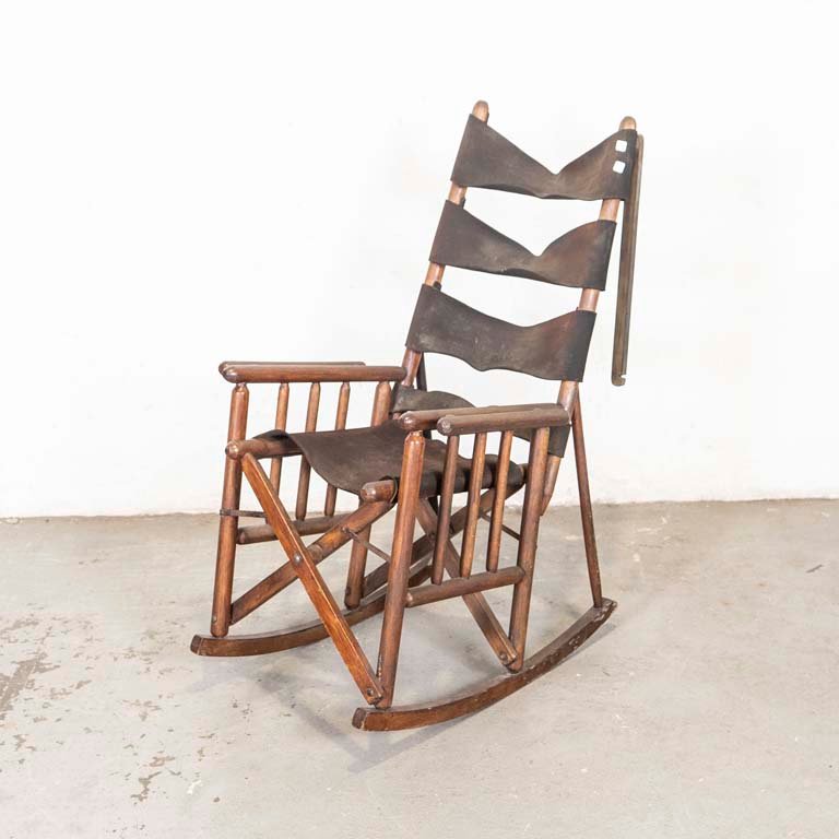Lote siguiente: Sillón mecedora plegable de madera y cuero para restaurar