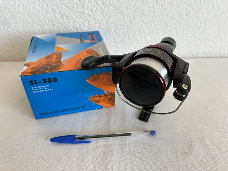 Reel de pesca nuevo y accesorios - imagen 3