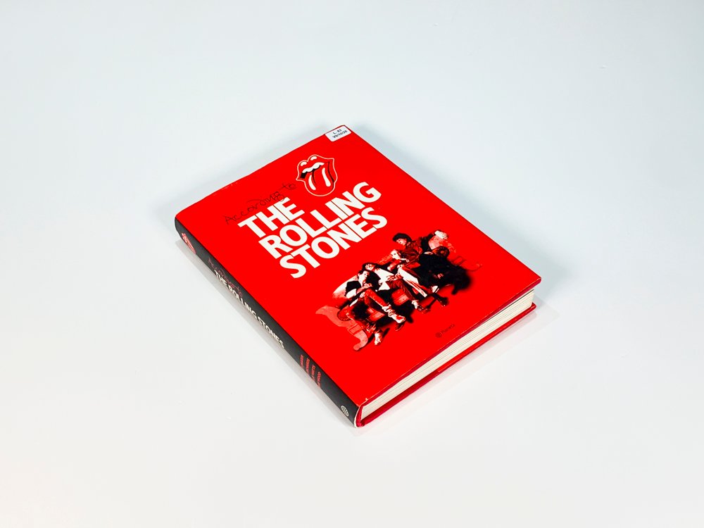Libro "Los Rolling Stones - According To" con Tapa Roja y Firmas