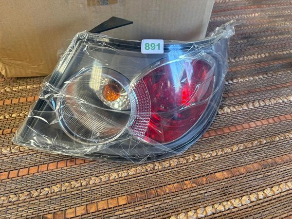 Faro trasero negro, en caja. - imagen 1