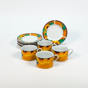 Lote siguiente: Juego de 4 Tazas y 6 Platos de Porcelana con Decoración Floral