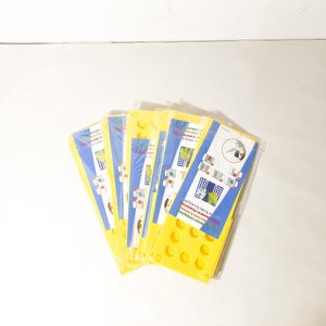 Lote siguiente: Juego de 6 Dobladores de Ropa Amarillos Nuevos