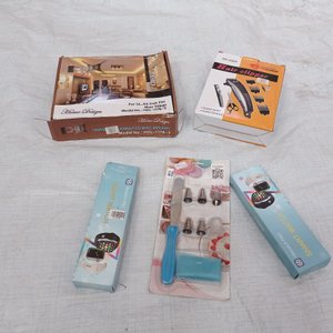 Cinco piezas: soporte de tv + dos smart watches + set de repostería + cortadora de cabello. - imagen 1