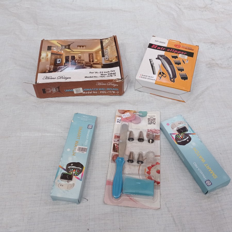 Cinco piezas: soporte de tv + dos smart watches + set de repostería + cortadora de cabello.