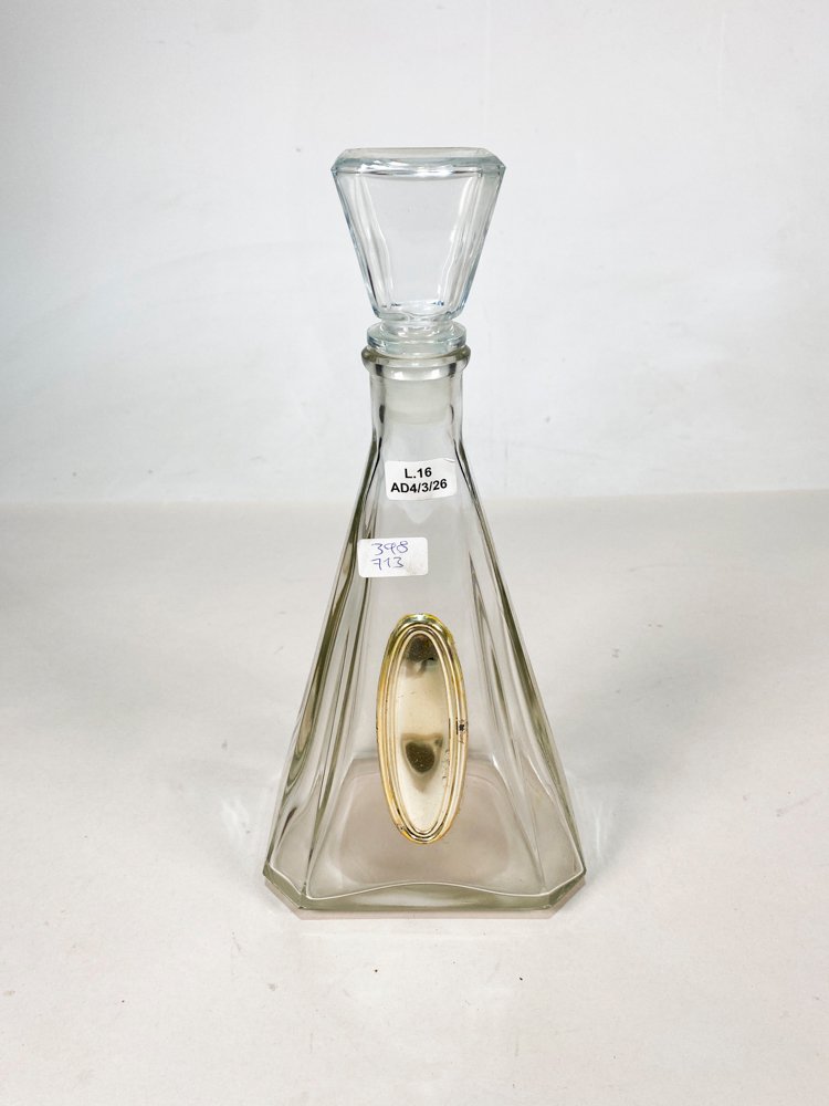 Botella de vidrio con etiqueta dorada y anillo - imagen 1