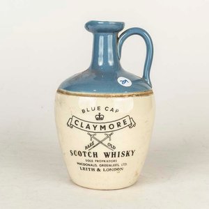 Lote siguiente: Porrón de Whisky Claymore Blue Cap - 22 cm