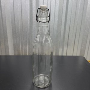 Lote anterior: Botella de Vidrio Transparente con Cierre de Bisagra y Relieves Verticales