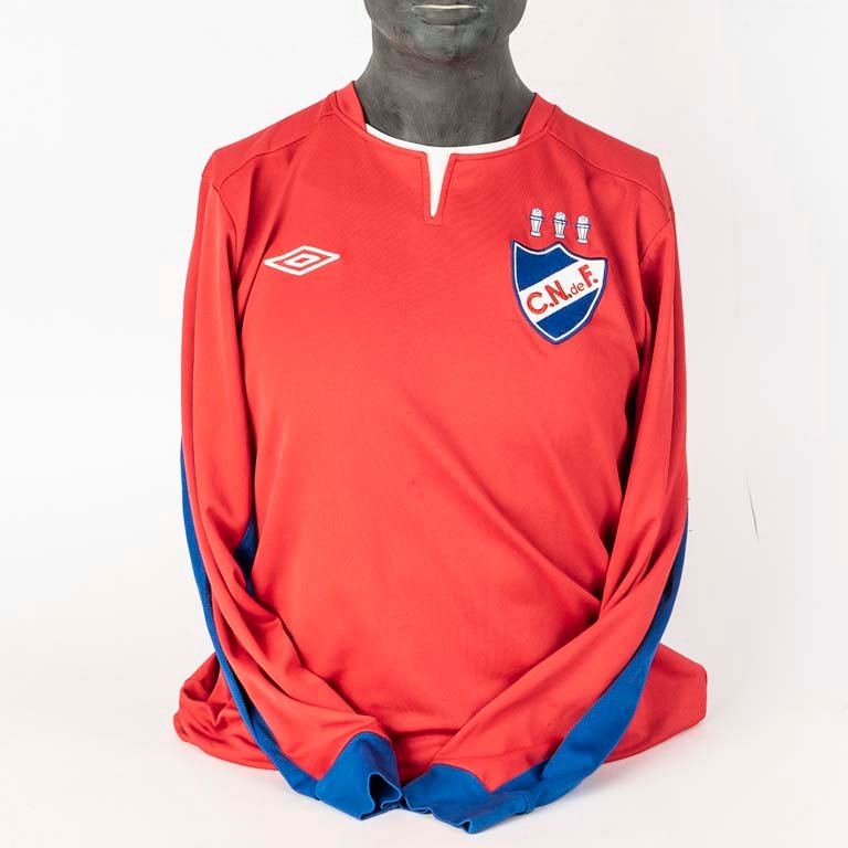 Lote anterior: Camiseta de Nacional oficial de tienda marca UMBRO segunda equipación del año 2012