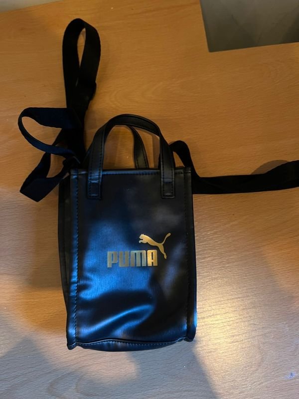 Lote siguiente: Bandolera portacelular Puma original nueva
