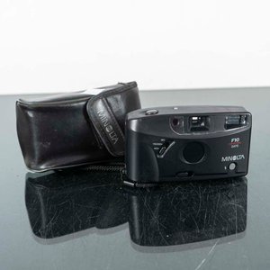 Lote siguiente: Cámara Fotográfica Minolta F10 con Funda Negra
